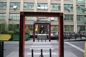 Iron beam structures frame a passage between buildings at Industry City